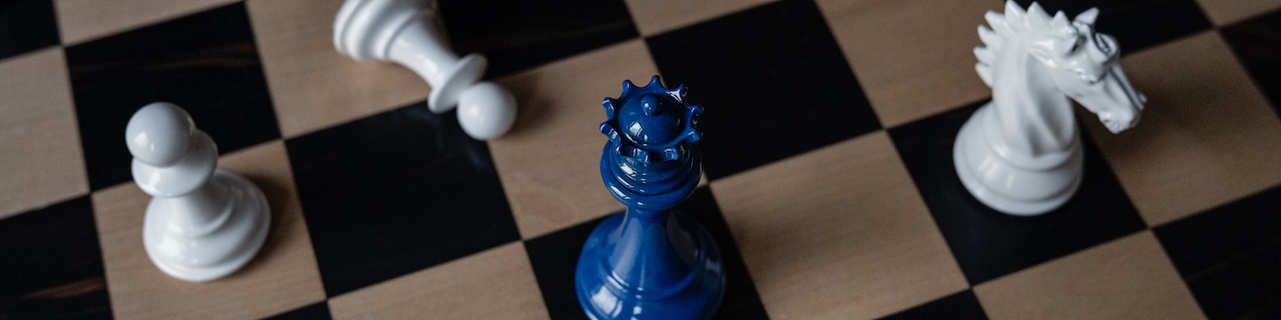 Chess pieces with blue king